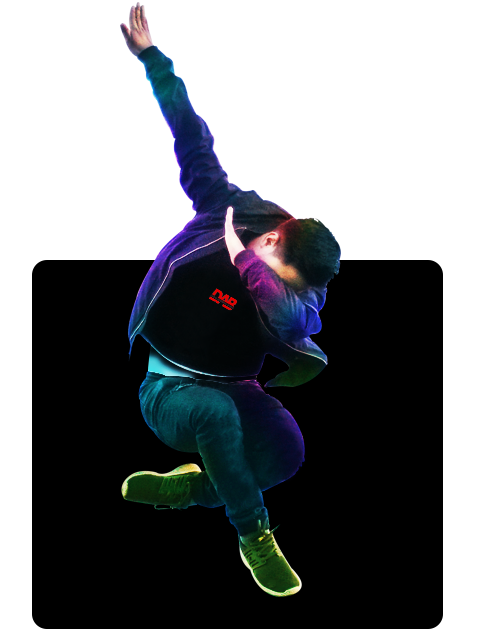 A boy jumping in the air while dabbing
